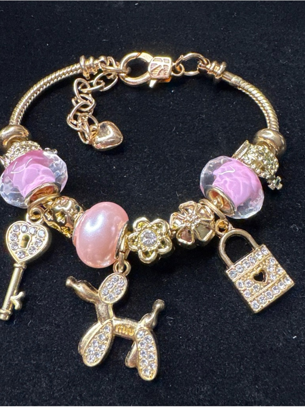 Gold-Tone Pink Glass Charm Bracelet with Balloon Dog and Lock Charms